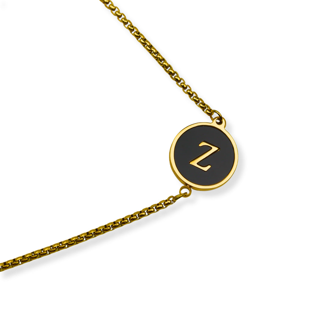 Pulsera con inicial - oro y negro - letras A a Z - ajustable